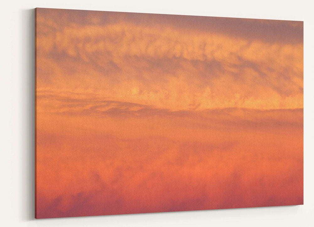 Orange-colored lenticular clouds at sunset, Carpenter Mountain, Oregon