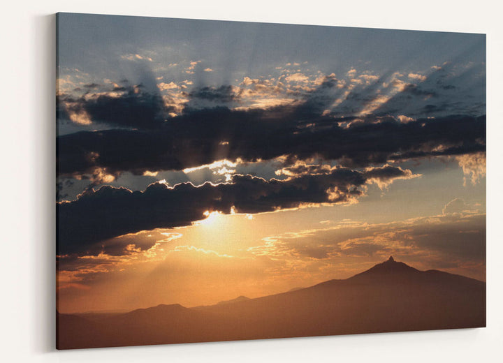 Mount Washington at sunrise with crepuscular sunrays, Willamette Forest, Oregon