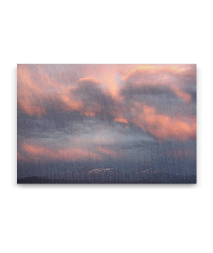 Pink or purple colored clouds at sunset over the Three Sisters, Oregon